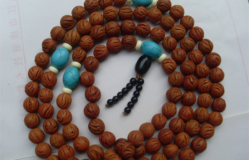 龙纹桃核手串18罗汉盘玩效果,桃核手串越盘越红起到什么作用