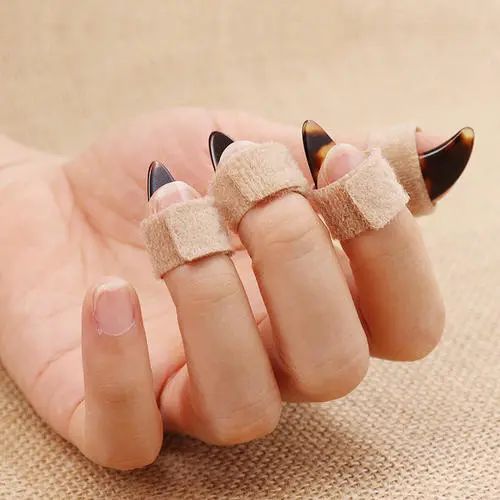 什么材质的古筝指甲音色好,古筝义甲材质