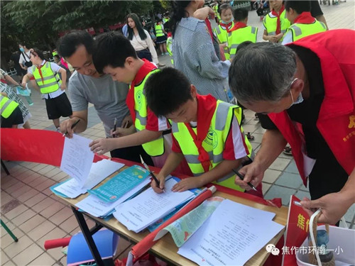 焦作一中暑假志愿活动,开展文明校园志愿服务活动