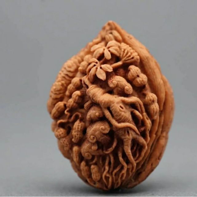 橄榄核雕方寸之间,舟山核雕方寸之间