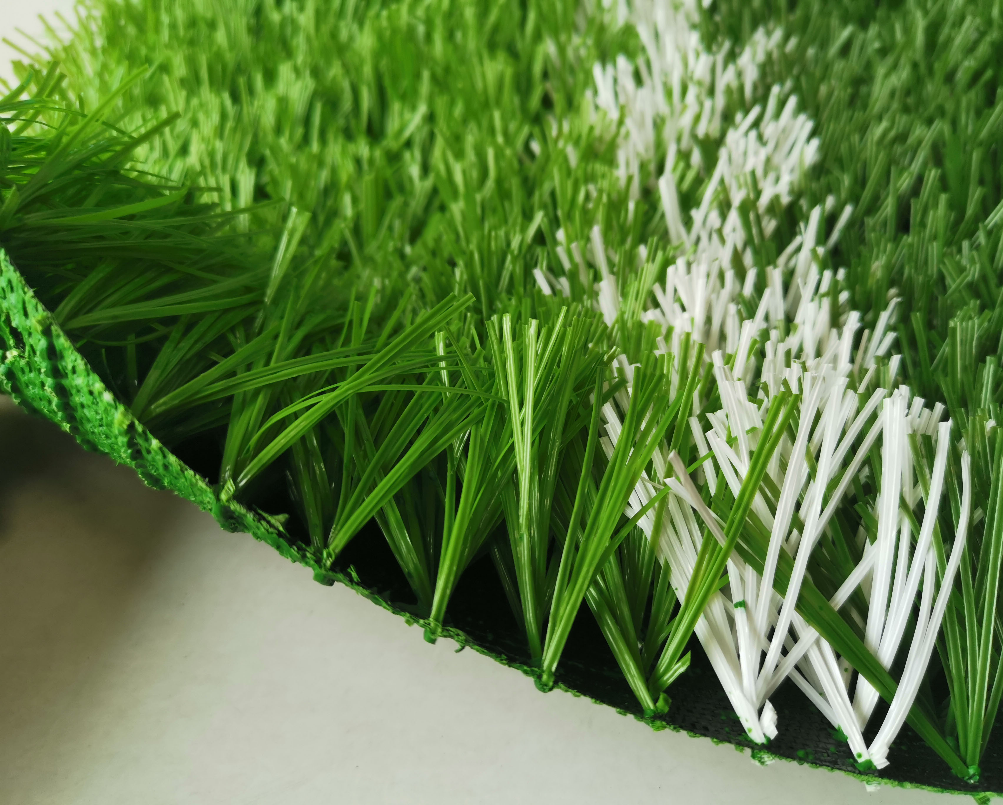 塑胶足球草皮多少钱一平,足球场草皮价格多少一平方世界杯