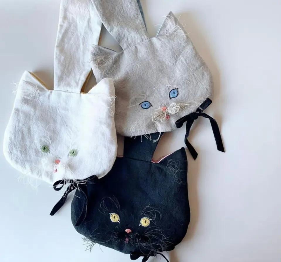 猫咪刺绣帆布包,猫咪揣手款包